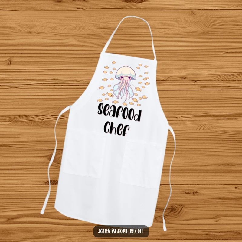Funny apron showing a happy jellyfish drifting through a school of tiny fish, perfect for cooking with marine humor.