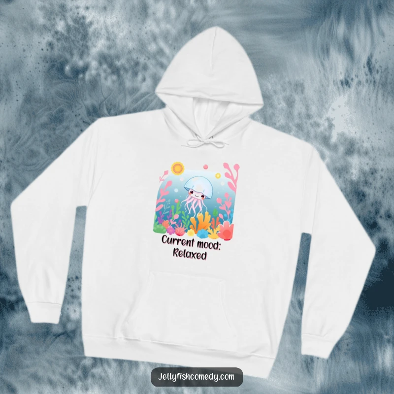 Funny Hoodie: A smiling jellyfish gracefully drifts amid a lush garden of colorful underwater plants, offering cozy, humorous tranquility.