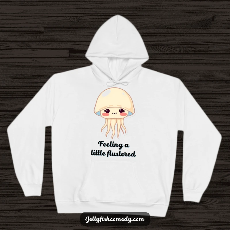 Cozy hoodie featuring a shy jellyfish with prominent rosy cheeks, radiating sweetness and a hint of bashful charm.