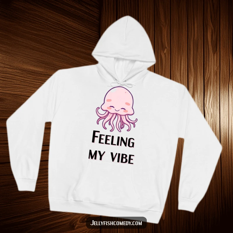 Funny hoodie depicting a giggling jellyfish with closed eyes and moving tentacles, perfect for cozy joy.