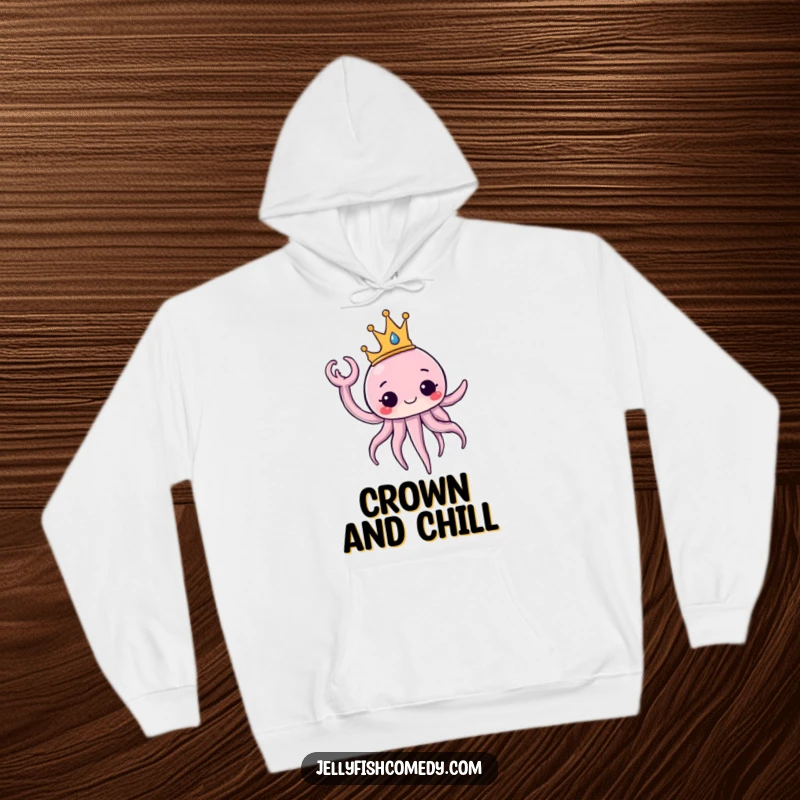 Funny Hoodie displaying a jellyfish wearing a majestic crown and waving a tentacle with regal flair. This apparel offers royal comfort.