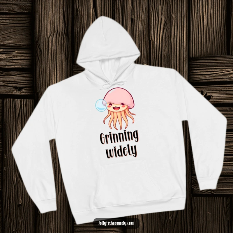 Funny grinning jellyfish hoodie shows a happy jellyfish blowing a bubble, offering cozy ocean-themed joy and humor.