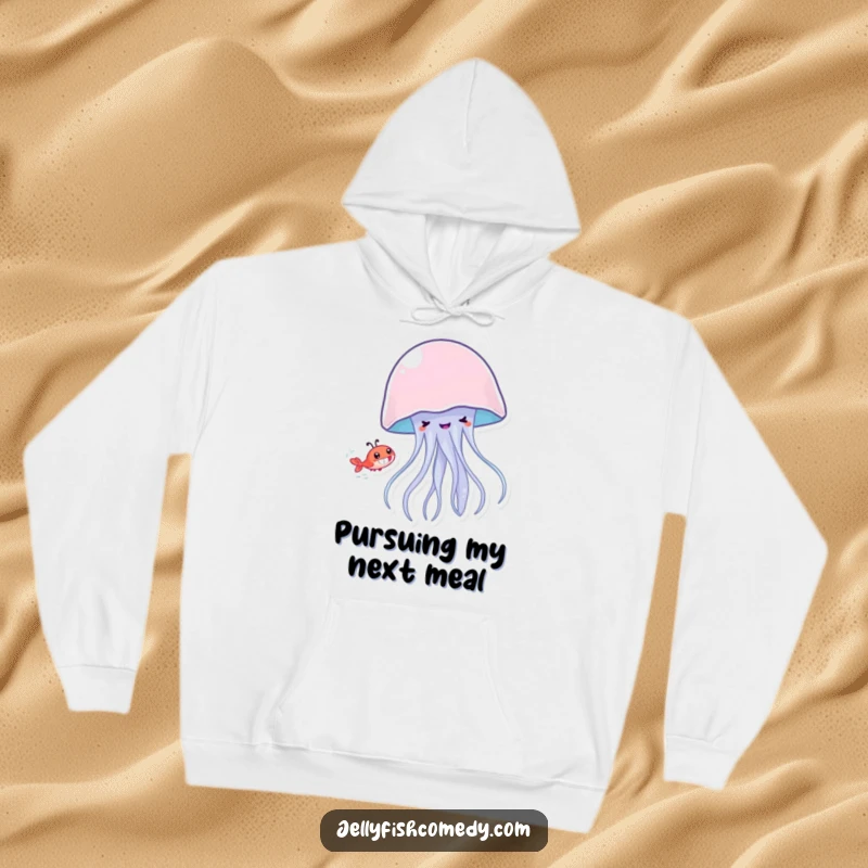 Funny jellyfish with a big grin playfully chasing a tiny shrimp, comfortable hoodie for cozy and humorous wear.