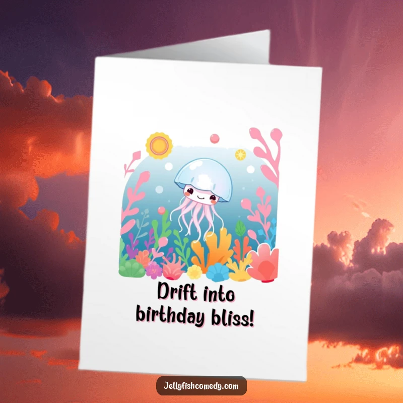 Free Printable Birthday Card of a smiling jellyfish peacefully drifting among vibrant, colorful underwater plants.