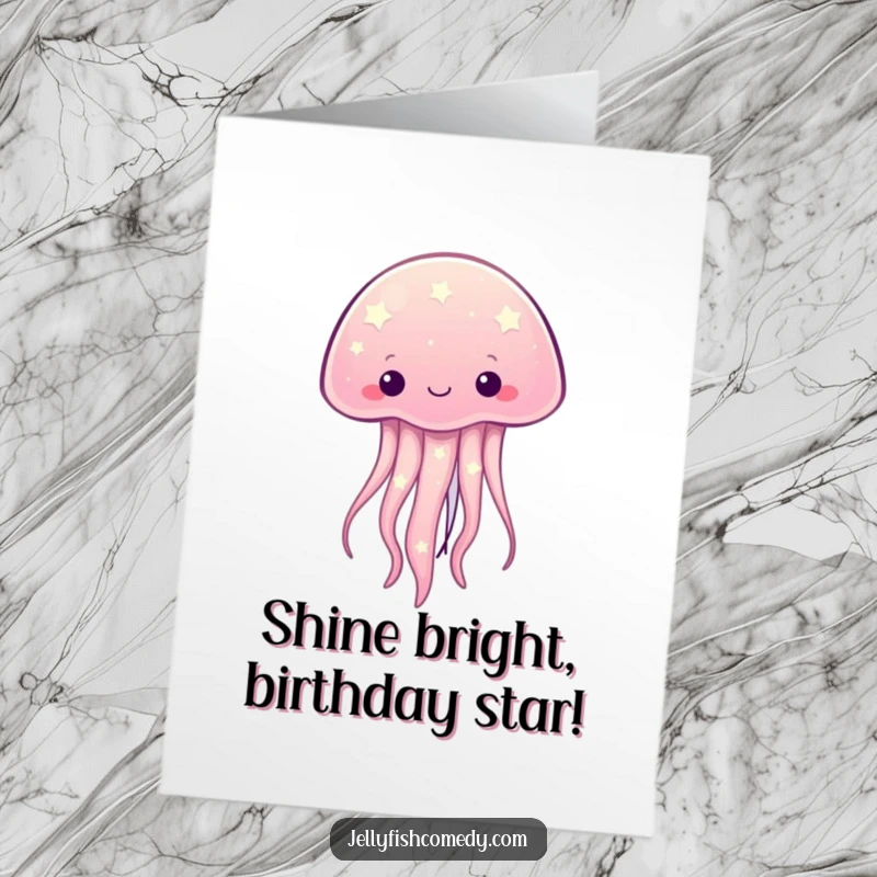 Funny free printable birthday card: A kawaii jellyfish adorned with twinkling stars glows brightly, sending cosmic birthday wishes.