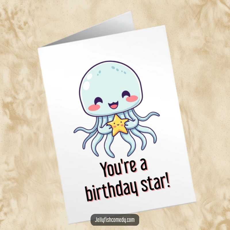 Funny Free Printable Birthday Card featuring a happy jellyfish tenderly holding a tiny, glowing star with its tentacles.