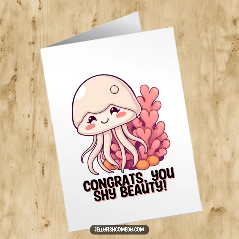 Shy free printable congratulations card with a smiling jellyfish peeking from behind coral, a cute way to celebrate success.