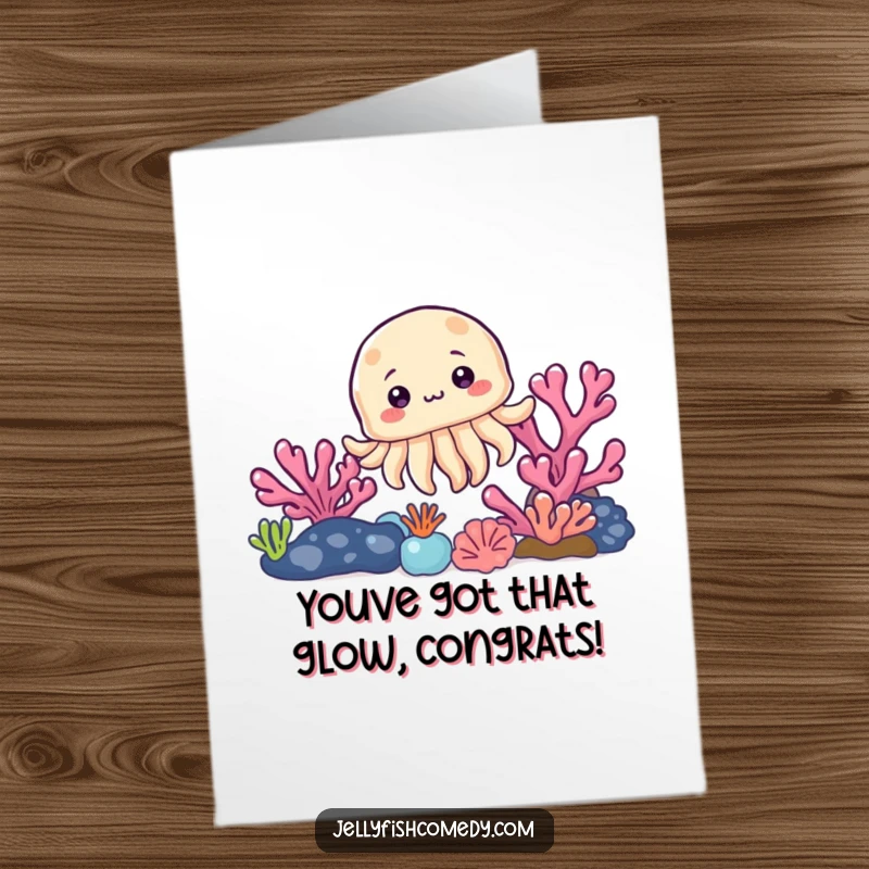 Free Printable Congratulations Card: A cute jellyfish curiously peeks from behind a coral reef, offering a delightful, funny congratulatory message.