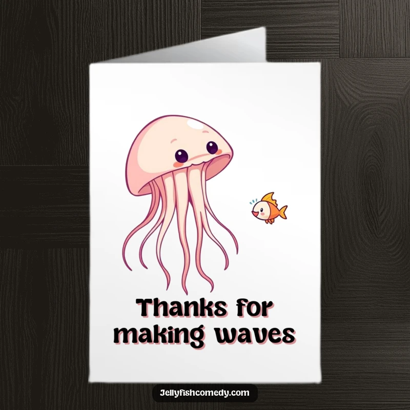 Funny free printable fish-tossing jellyfish thank you card, tossing a tiny fish playfully, an amusing downloadable note.